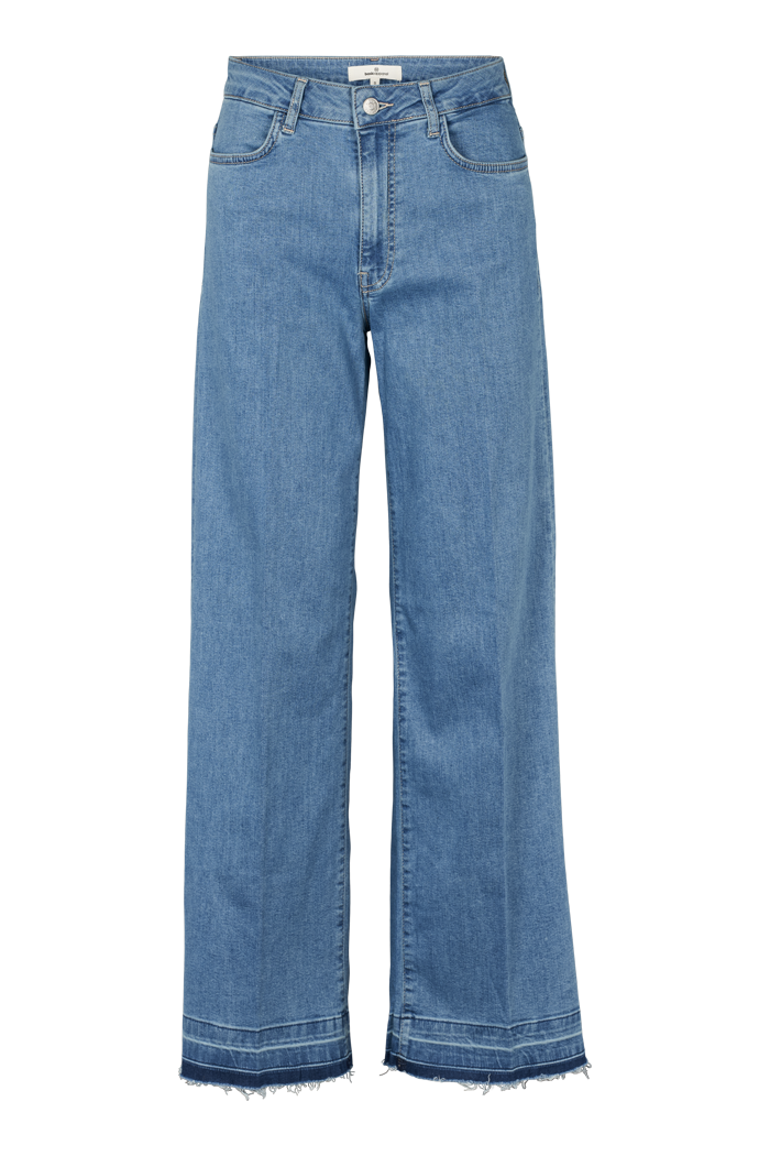 Jean Enya en denim bleu, ourlet frangé
